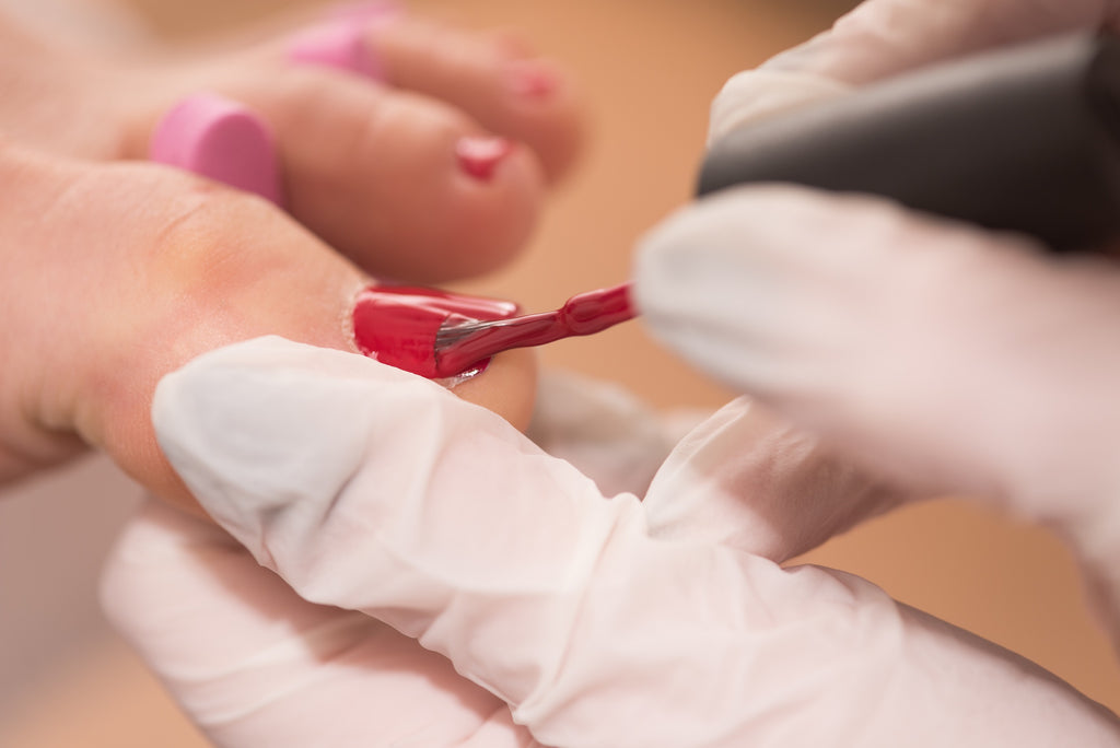 Wearing Gloves as a Nail Technician for Manicures and Pedicures